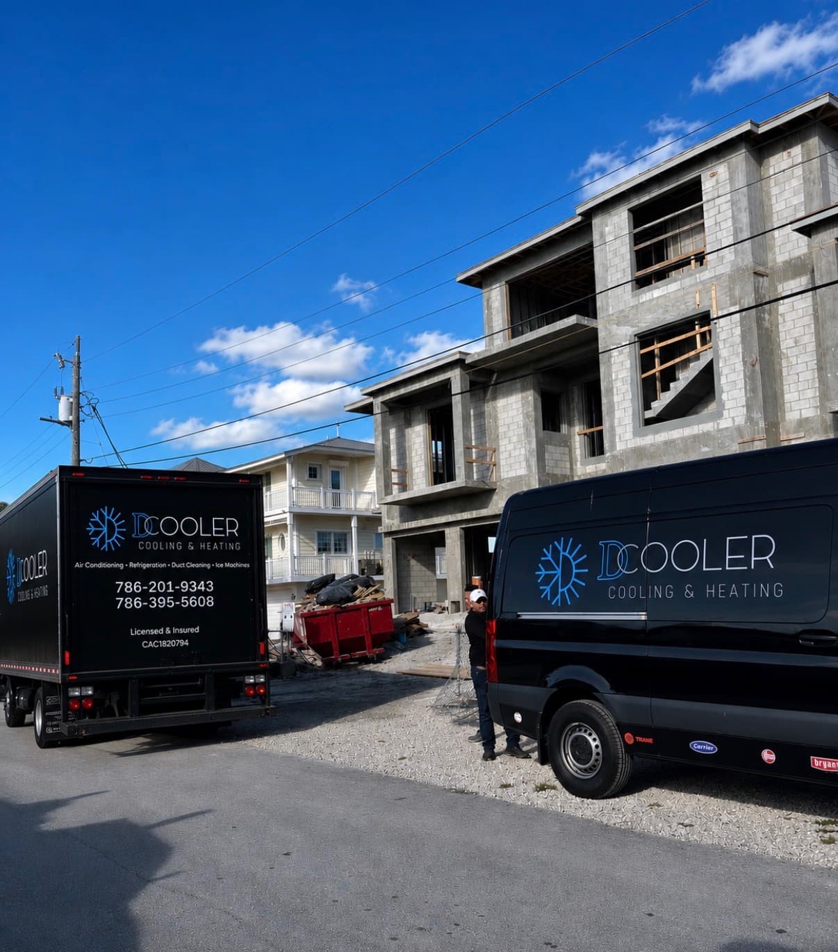 D'Cooler Cooling & Heating vehicles at a new construction HVAC project